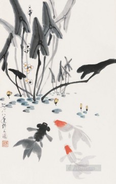 Wu Zuoren jouant du poisson 1988 poissons Peinture à l'huile